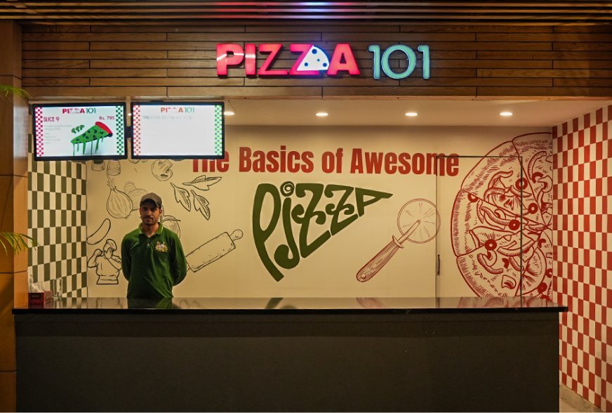 A Pizza 101 pizza on a wooden board
