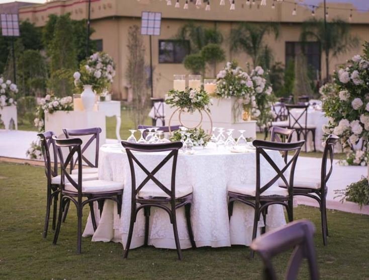 Tables dressed for a garden event by Monal Marquee