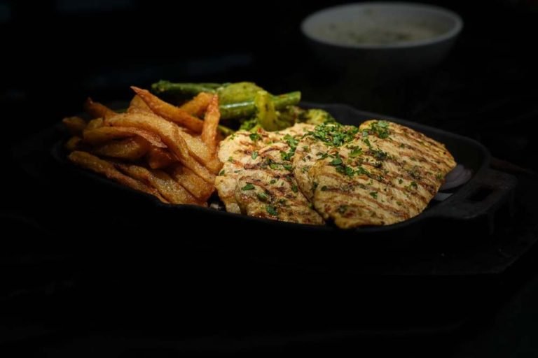 Grilled chicken and fries from The Monal menu