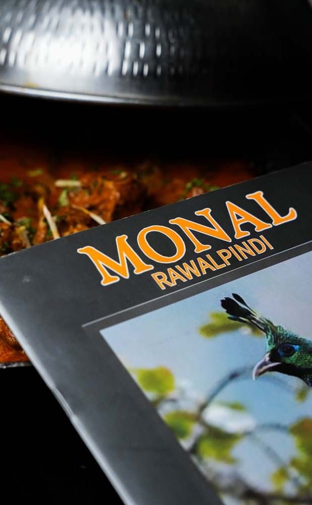 A Monal karahi beside the Monal Rawalpindi menu